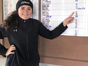 Photo submitted - Alex Torres points to her score of 92, shot in challenging and very difficult conditions Monday. She tied for 11th overall out of 62 golfers, who battled cold temps, thick fog and windy conditions at Mountain Glen Golf Club. This will be the Franklin senior’s third trip to the Pinehurst area for the state tournament. 