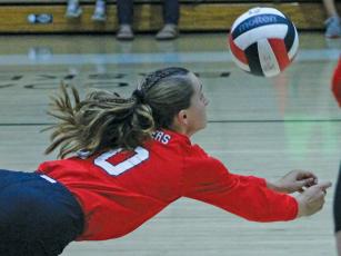 Press photo/Andy Scheidler Sophomore Kendall Reis dives for a dig during junior varsity action Sept. 26 against Hendersonville.  The Panthers went 20-1 this season, suffering a lone loss to conference foe Brevard. 