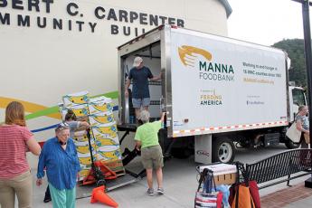 The Macon Program for Progress and MANNA Food Bank teamed up for another pop-up food bank on Monday.
