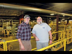 Press photo/Lee Buchanan Beasley Flooring plant manager Chris Norton, left, and production manager Richard Burch are shown in the Franklin facility.