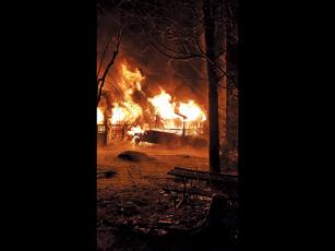 Photo submitted Firefighters arrived on the scene to find the house fully engulfed in flames.