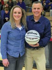 Photo provided - Franklin’s all-time leading scorer Lindsay Simpson presented a 200 wins ball to coach Scott Hartbarger. 