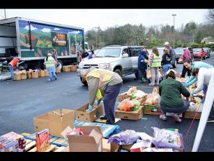Press photo/Linda Mathias - MANNA’s mobile food bank ran out of food on March 23 due to high demand.