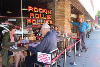 Press photo/Jake Browning - Rockin’ Rollie Pollies, in owner Roland Mock’s words, welcomed customers back “at 5:01 the day the governor said we could at 5”. From left, customers Amy Evans-Fisher, George Fisher, Virginia Brubeck and Phil Walker.