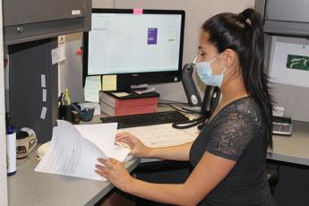 Press photo/Jake Browning - Ivonne Rios is in charge of medication assistance for the clinic