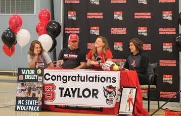 Press photo/Will Willover - The Ensley family celebrates Taylor’s signing. From left: her sister Tori, her dad Todd, Taylor and her mom Kim.