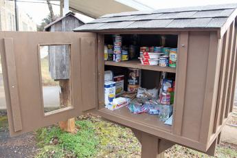 Press photo/Jake Browning - Little food pantries, including this one at Cowee School, have popped up across the county.