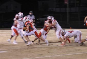 Press Photo/Will Woolever - Junior running back/safety Kellen Stiles carries against Hendersonville in the Panther Pit March 12. Stiles recorded two interceptions against East Henderson March 26.