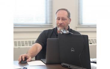 Press photo/Jake Browning - Information Technology Director Tim Burrell reviews Macon County Schools’ cyber security measures. 