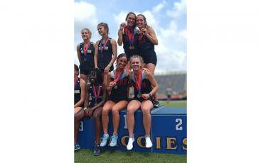 Photo courtesy of Melissa Ward - Women’s 4x400-meter relay State Champions (clockwise from top left) Hannah Angel, Hope Smith, Dylan Garcia, and Maria Sgro show off their gold medals on the State Championship podium.