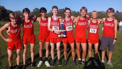 Photo courtesy of Melissa Ward - Men’s cross country team members (from left) David Olaski, Andrew Garrison, Landon Chavonic, Barrett Stork, Logan Russo, Aaron Ashe, Dominic Faetz and Cooper Tyler show off their second-place trophy from the Mountain 7 Conference Championship Oct. 19. 