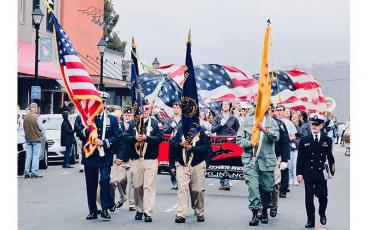 Press photo/Braulio Fonseca - American Legion members lead the Nov. 11 Veterans Day parade on Main Street.