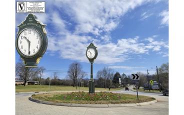 A digital rendering of the clock and landscaping planned for the roundabout at Womack Street.