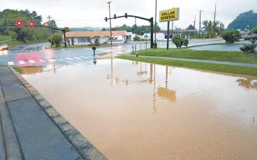 Photo/Bob Scott - A waterline break on Monday morning left Lakeside Drive flooded between Hardee’s and Dollar General. The leak has been stopped, but the road will remain closed until DOT can repair the road surface.