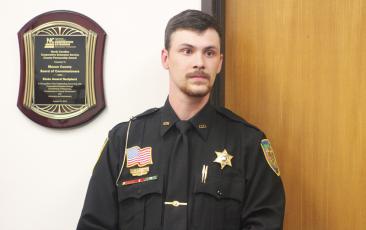 Press photo/Thomas Sherrill - Deputy Daniel Long was one of the two Macon County Sheriff’s Deputies to receive the Life Saving Award at the July 11 Macon County Board of Commissioners meeting. Deputy Brandon Carter also received the award but was not in attendance at the meeting.