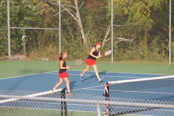 Press photo/Will Woolever - Sisters Laura and Lydia Holland are pictured in a doubles match versus West Henderson on Senior Night Oct. 4.