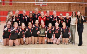 Photo courtesy of Ronnie Vanhook MMS volleyball is pictured with their Blue Ridge Athletic Conference Championship plaque after defeating Polk in the BRAC Final Oct. 23. 