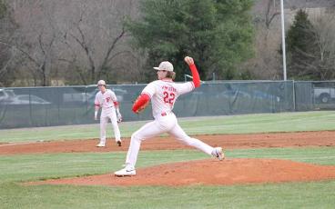 Press photo/Will Woolever - Senior Abram Apel pitches to Murphy in Franklin’s season-opening win Feb. 29. 