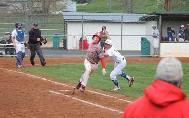 Freshman Anderson Terrell avoids a tag versus Smoky Mountain in Sylva April 12.  (Press photo/Will Woolever)