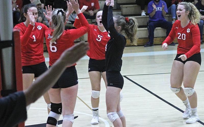 Press photos/Andy Scheidler - With the official’s arm signaling the last point, players on Franklin’s volleyball team celebrate winning the first set Saturday against Draughn. From left: Maitlyn Rewis, Alison Knop, Adrianne Duvall, Rhiley Bryson, Taylor Carlton.