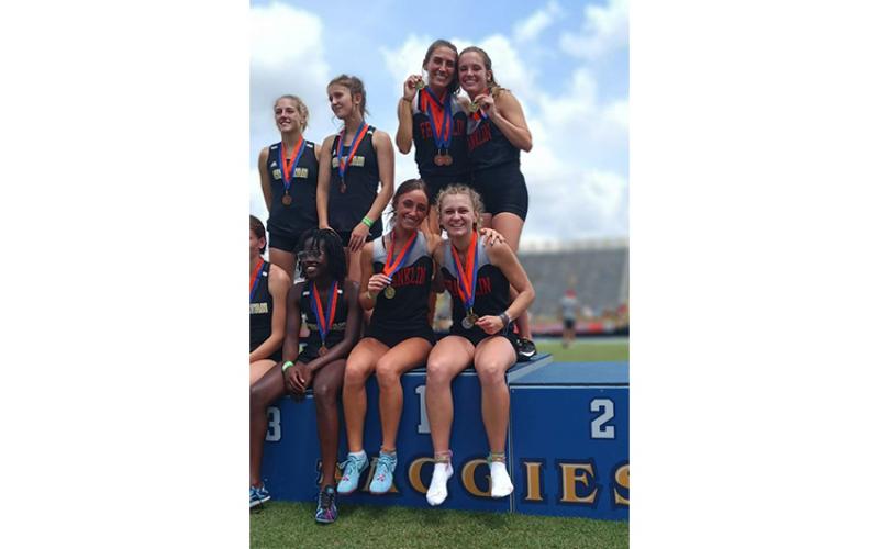 Photo courtesy of Melissa Ward - Women’s 4x400-meter relay State Champions (clockwise from top left) Hannah Angel, Hope Smith, Dylan Garcia, and Maria Sgro show off their gold medals on the State Championship podium.