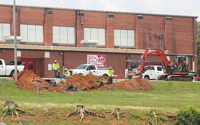 Press photo/Thomas Sherrill - Work for the initial phase of the new Franklin High School got underway Monday, June 17. Crews will work throughout the summer on pipes below Panther Drive and the lower parking lot in advance of major building work expected to start this October. A groundbreaking ceremony planned for June 20th has been postponed.